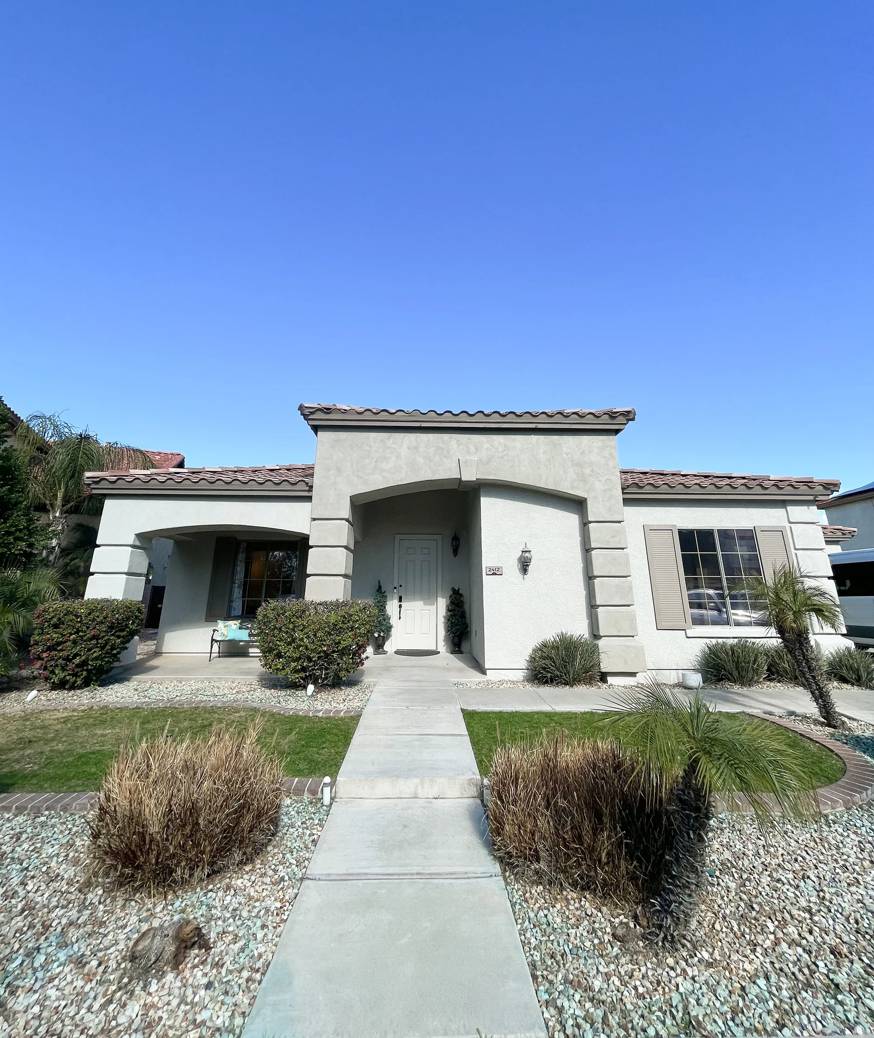 The Oasis at Norterra residence, a stucco home with desert landscaping in North Phoenix
